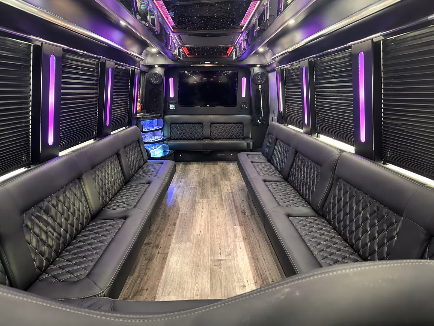 Friends laughing during a party bus celebration in Las Vegas